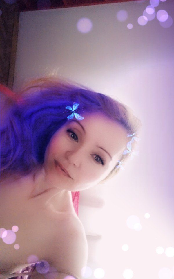 Snapchat Selfie with blue butterflies. Photo by Julia Kalman