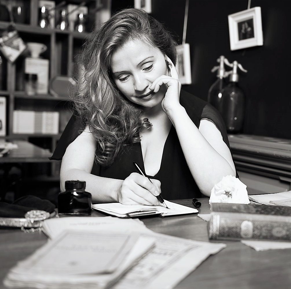 Photo of Julia Kalman, at the writers desk, at the Front Room, by Dumitru Antonescu