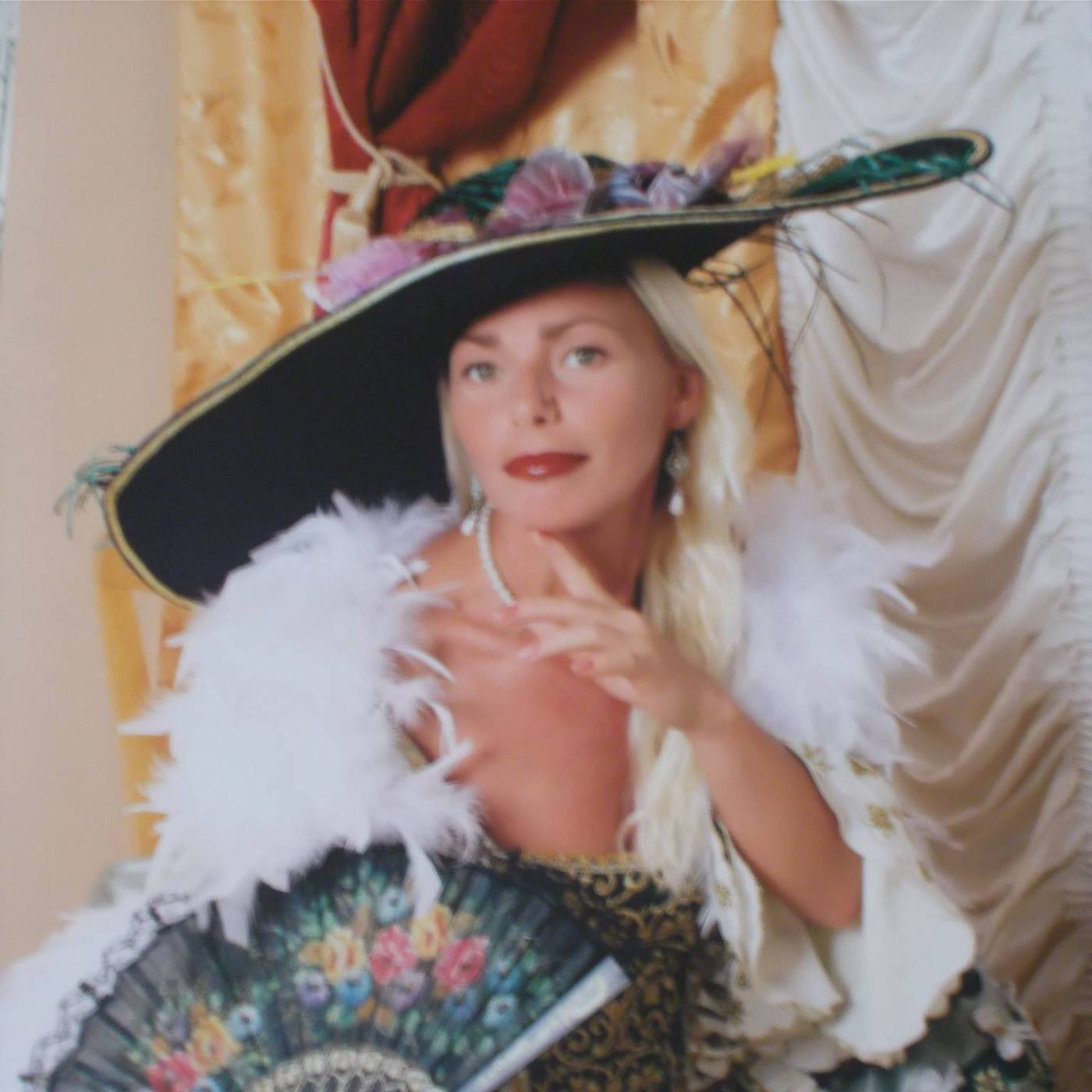Photo of beautiful Valerie Blanche, with hat and fan