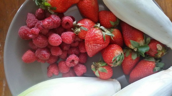 Close up with strawberries, raspberries and endivia